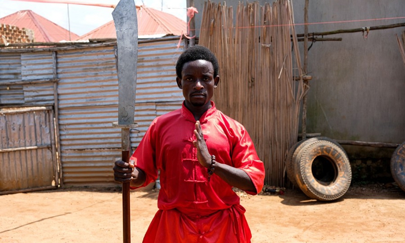 Manisuru Ssejjemba poses during his Chinese martial arts training at a makeshift training center behind his house in Katooke, north of Uganda's capital Kampala, Aug. 17, 2021.(Photo: Xinhua)