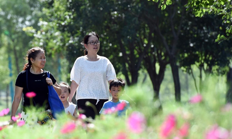 Tourists take a walk at Xinghuagou wetland park transformed from the mining subsidence area of Jingxing in Shijiazhuang, north China's Hebei Province, Aug. 24, 2021.Photo: Xinhua