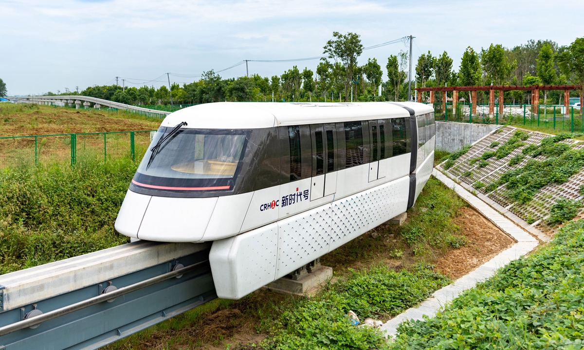 A technician tests a straddle-beam monorail train on Thursday in Feidong county, Hefei, East China's Anhui Province. In recent years, Feidong has been developing local transport, and it is promoting a 2.12 million-square meters new transport industrial park as it seeks to become a transport industrial cluster. Photo: cnsphoto