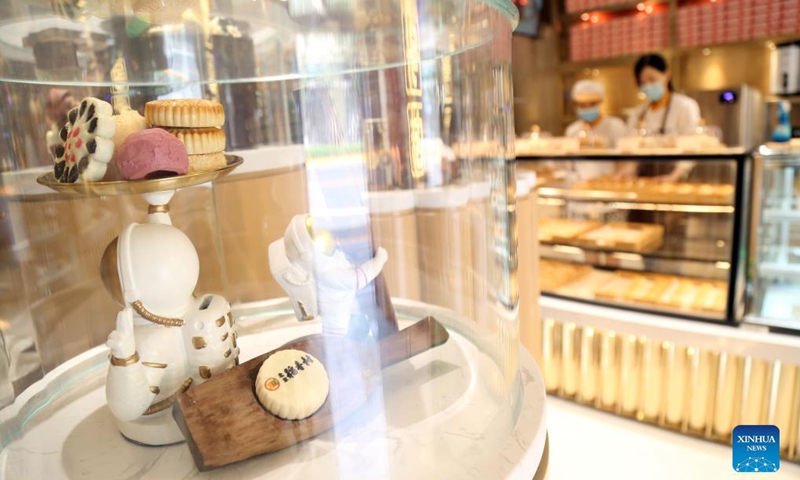 Photo taken on Aug. 25, 2021 shows the pastry models placed in the showcase of the new Daoxiangcun store in Beijing, capital of China.Photo: Xinhua