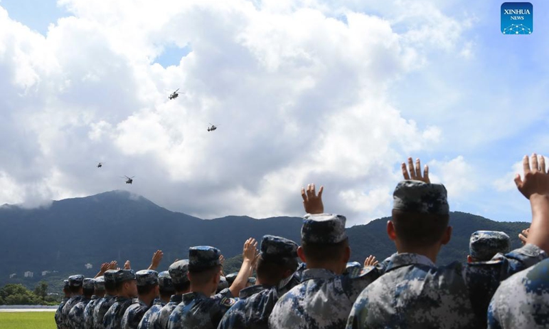 Officers and soldiers wave goodbye to their comrades leaving Hong Kong on rotation in Hong Kong, south China, Aug. 25, 2021. Photo:Xinhua