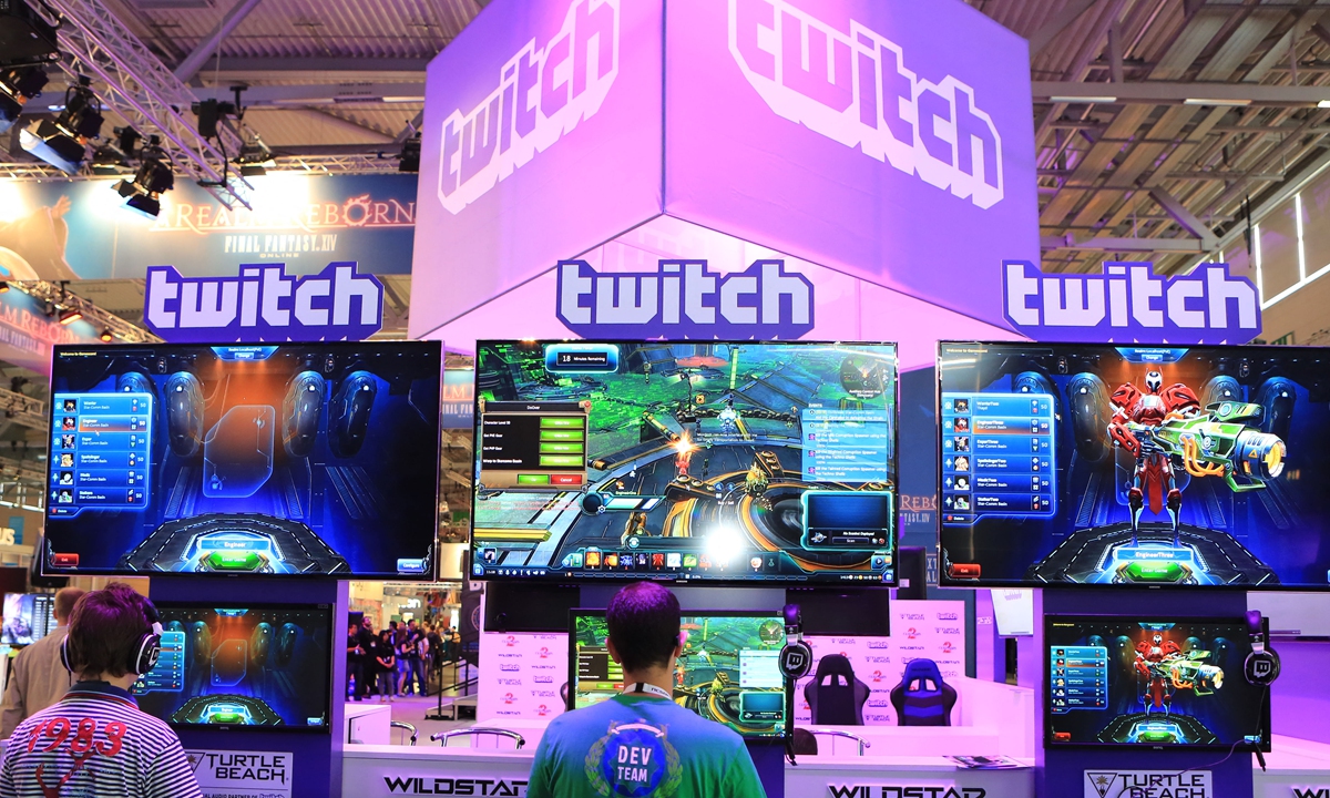People play games at the Twitch booth at Gamescom 2014 in Cologne, Germany on August 13, 2014. Photo: AFP