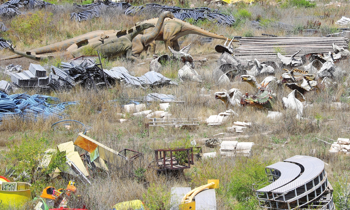 Dinosaur toys outside the abandoned