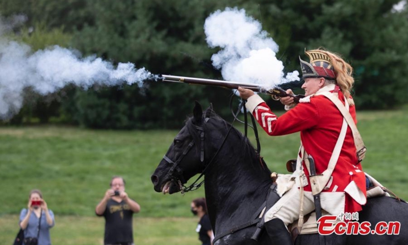 An actor performs horseback shooting at Green-Wood Cemetery, New York, the United States, Aug. 29, 2021.Photo: CNSphoto 