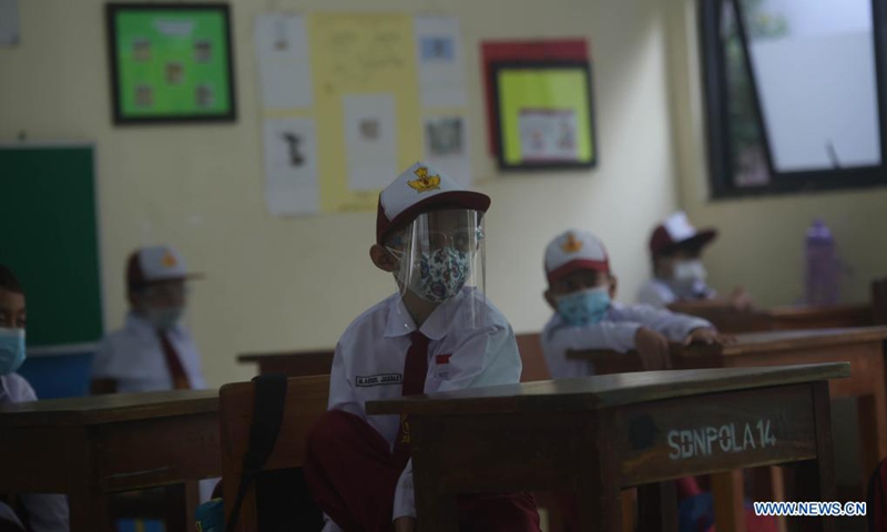 Students wearing protective gears attend a class at a school reopened after several months due to COVID-19 pandemic in Jakarta, Indonesia, Aug. 30, 2021. Photo:Xinhua