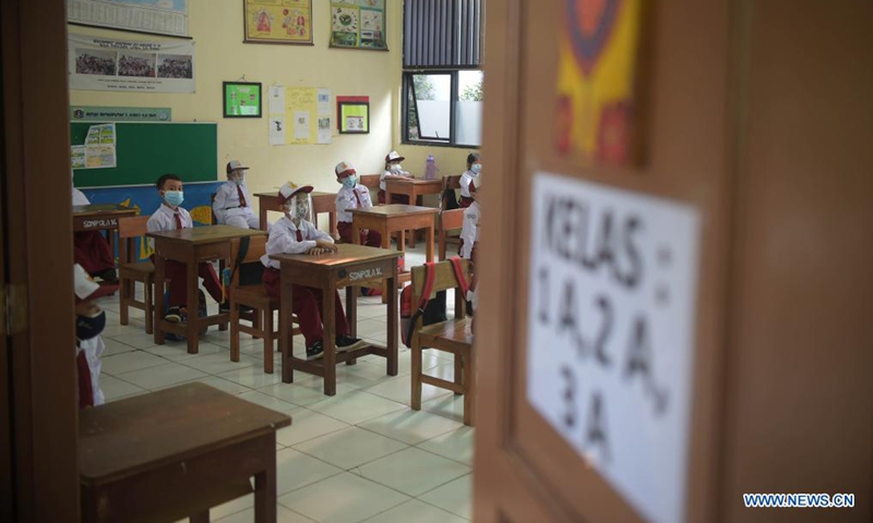 Students wearing protective gears attend a class at a school reopened after several months due to COVID-19 pandemic in Jakarta, Indonesia, Aug. 30, 2021. Photo:Xinhua