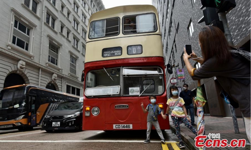 A retired Jumbo bus parks at roadside, attracting people to take photos at Tsim Sha Tsui, Hong Kong, Aug. 14, 2021.Photo: CNSphoto 