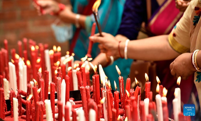 Devotees light candles at a temple on the occasion of festival of Janmashtami in Dhaka, Bangladesh, Aug. 30, 2021. Janmashtami is an annual festival that marks the birth anniversary of Hindu god Krishna.(Photo: Xinhua)