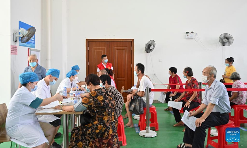 Elderly people from local villages queue up to get their blood pressure measured before receiving COVID-19 vaccines in Neikeng Town in Jinjiang City, southeast China's Fujian Province, Aug. 31, 2021. Photo: Xinhua 