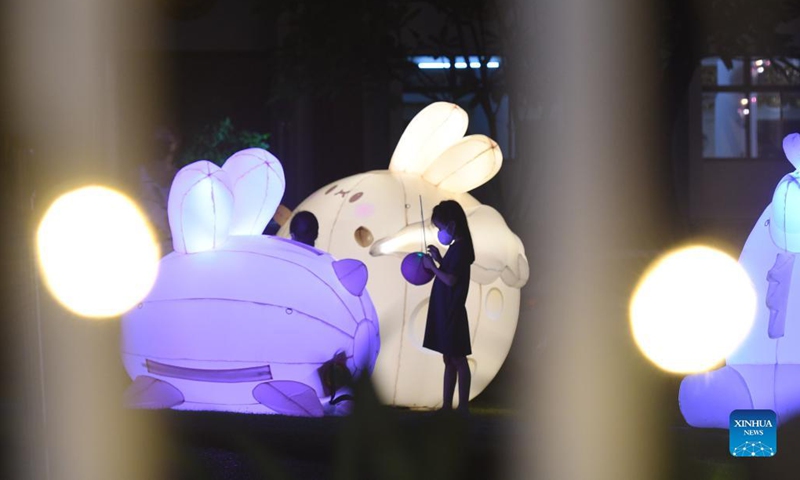 Children play around the jade rabbit lantern installations, as part of the Mid-Autumn Festival celebrations in Singapore, Aug. 30, 2021.(Photo: Xinhua)