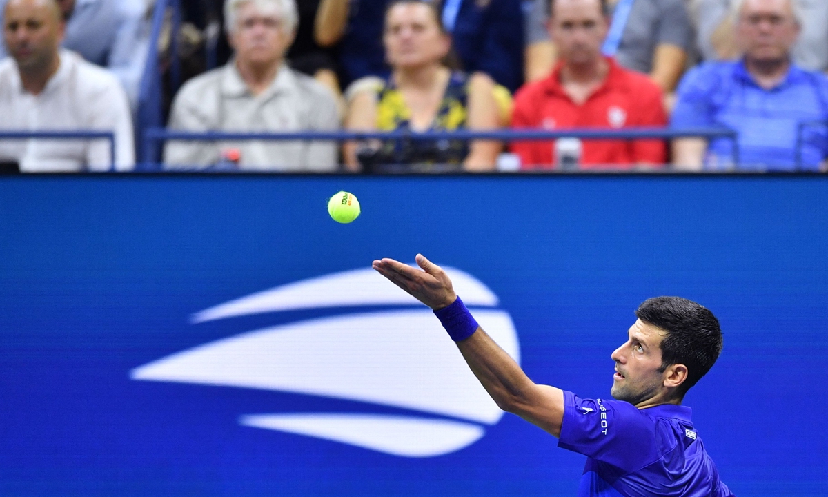 Novak Djokovic serves to Holger Rune during the US Open on Tuesday in New York City. Photo: VCG