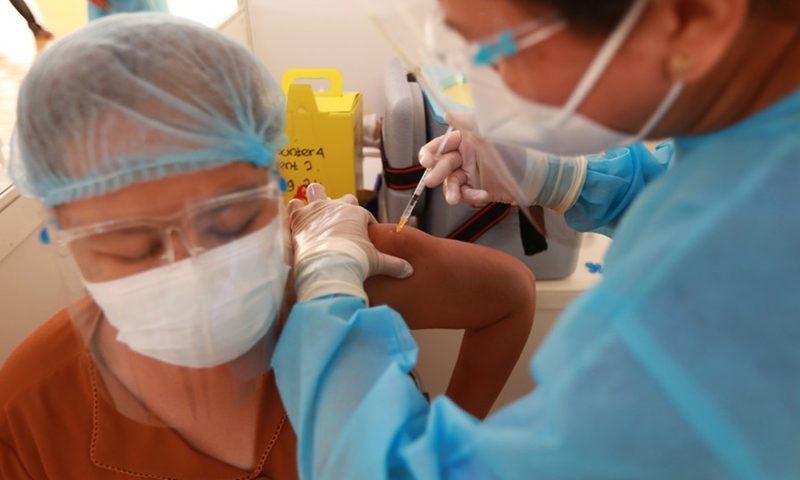 A woman receives a shot of China's Sinopharm COVID-19 vaccine at Myanmar Chinese Chamber of Commerce's COVID-19 Vaccination Center in Yangon, Myanmar, Sept. 1, 2021.(Photo: Xinhua)