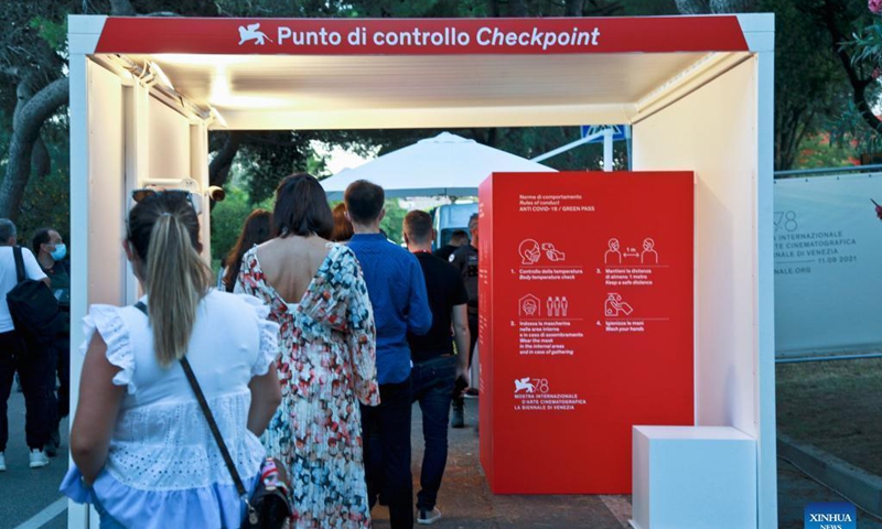 Audiences have their temperature checked before entering the venue of the 78th Venice International Film Festival in Venice, Italy, on Sept. 1, 2021. The 78th Venice International Film Festival kicked off in the Italian lagoon city on Wednesday evening, amid still stringent anti-pandemic measures, and a large line-up that includes the world premiere of Pedro Almodovar's new film Parallel Mothers.Photo: Xinhua 