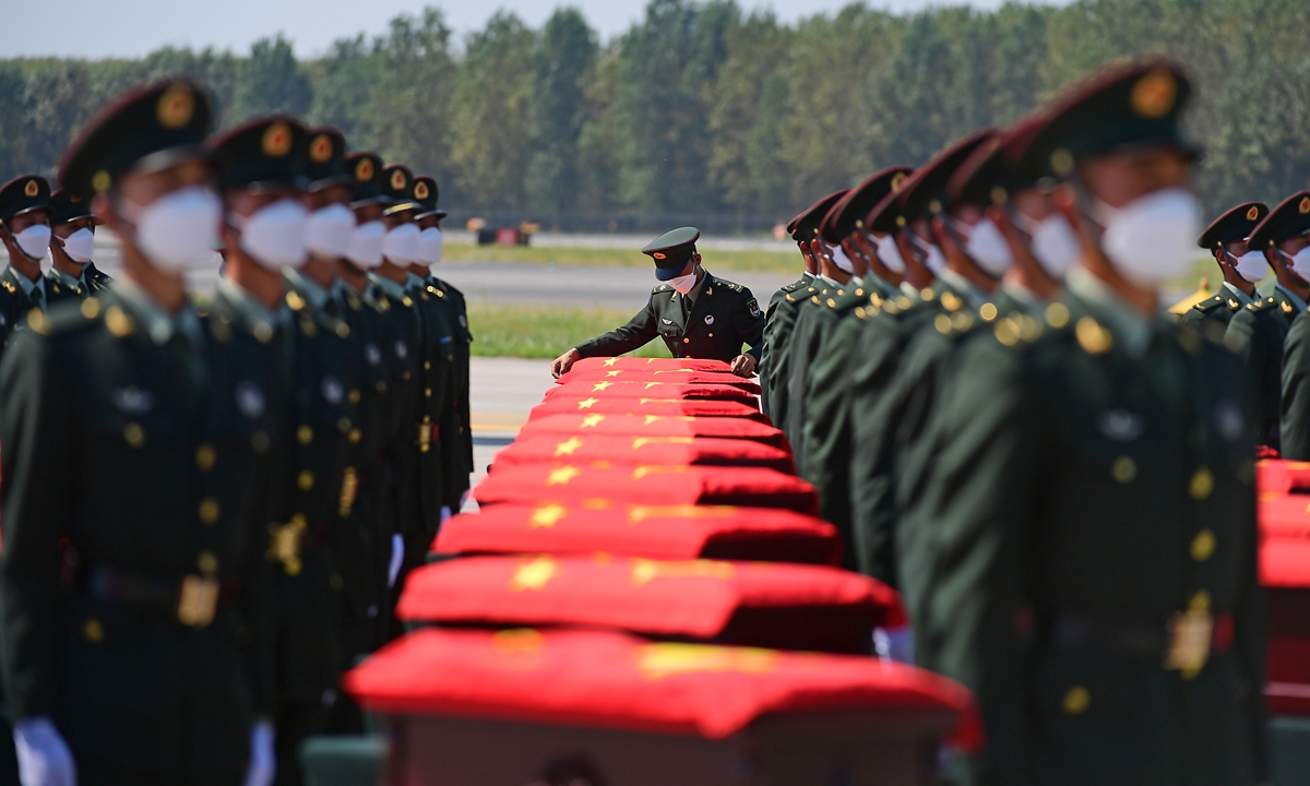 The remains of 109 Chinese People's Volunteers soldiers arrive at the Shenyang Taoxian International Airport in Northeast China's Liaoning on Thursday. Photo: cnsphoto