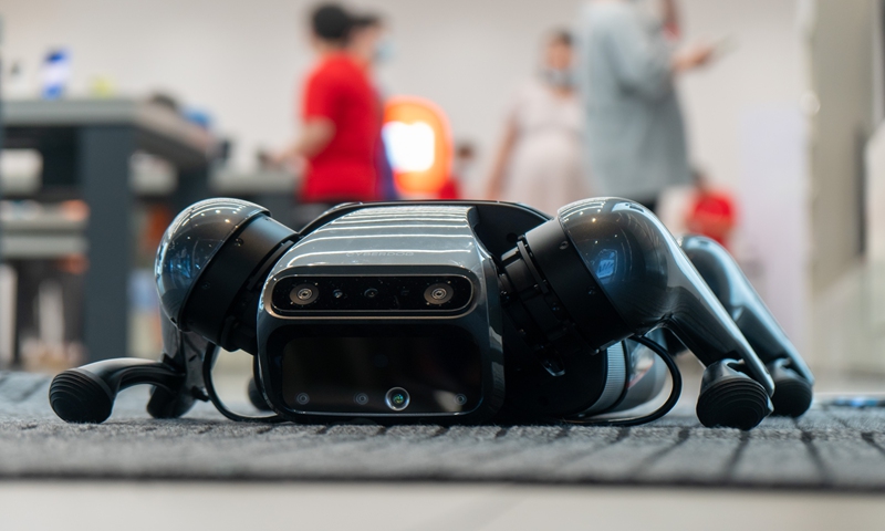 A Xiaomi CyberDog, a bionic quadruped robot, is displayed at a Xiaomi Mi Smart Home in Shanghai on Sunday. Xiaomi CyberDog is currently on a tour in China. Just 400 of the robots are available for a price of 9,999 yuan ($1,549). Some of the algorithms in Xiaomi's CyberDog came from the open-source community. Photo: VCG