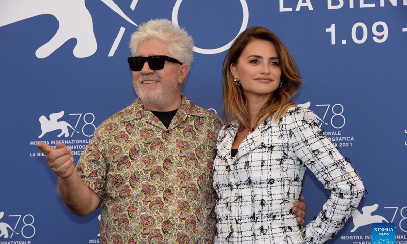 Director Pedro Almodovar and actress Penelope Cruz pose for photos during the photocall of the film Parallel Mothers at the 78th Venice International Film Festival in Venice, Italy, on Sept. 1, 2021. The 78th Venice International Film Festival kicked off in the Italian lagoon city on Wednesday evening, amid still stringent anti-pandemic measures, and a large line-up that includes the world premiere of Pedro Almodovar's new film Parallel Mothers.Photo: Xinhua 