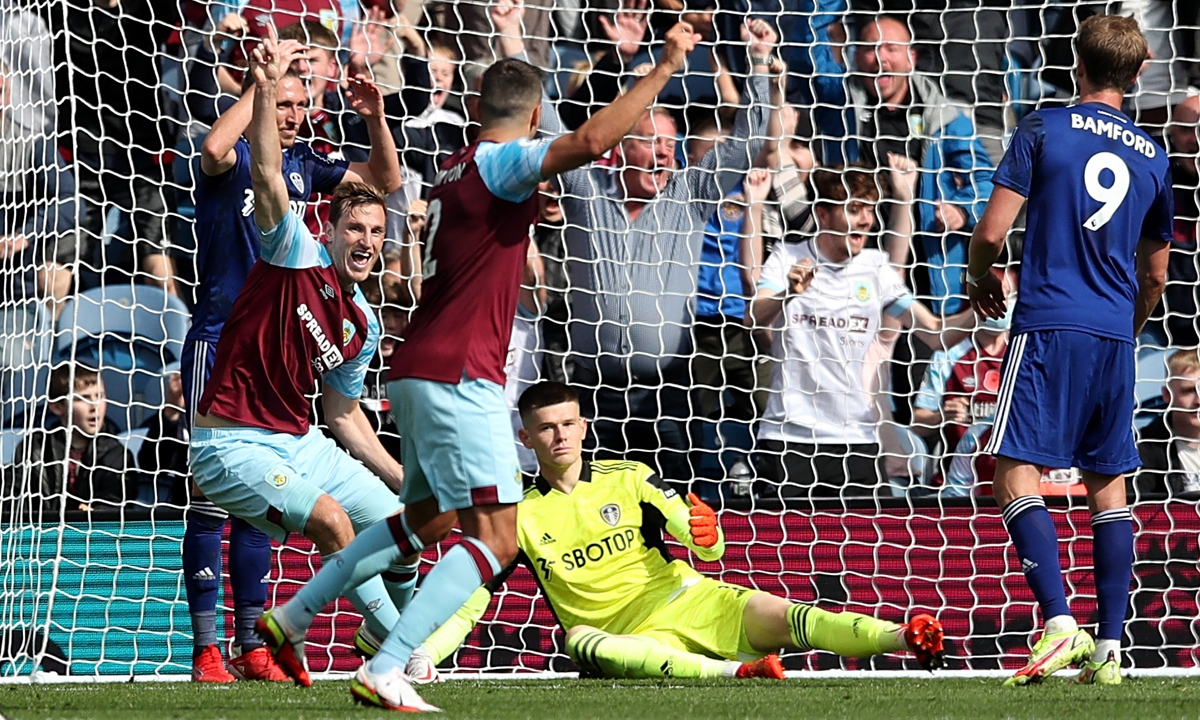 Chris Wood (second from left) of Burnley scores past Illan Meslier of Leeds United on August 29 in Burnley, England. Photo: VCG