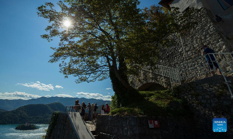Visitors overlook Bled lake from Bled castle in Slovenia, Sept. 1, 2021. Bled lake is one of the most attractive tourist destinations in Slovenia.Photo:Xinhua