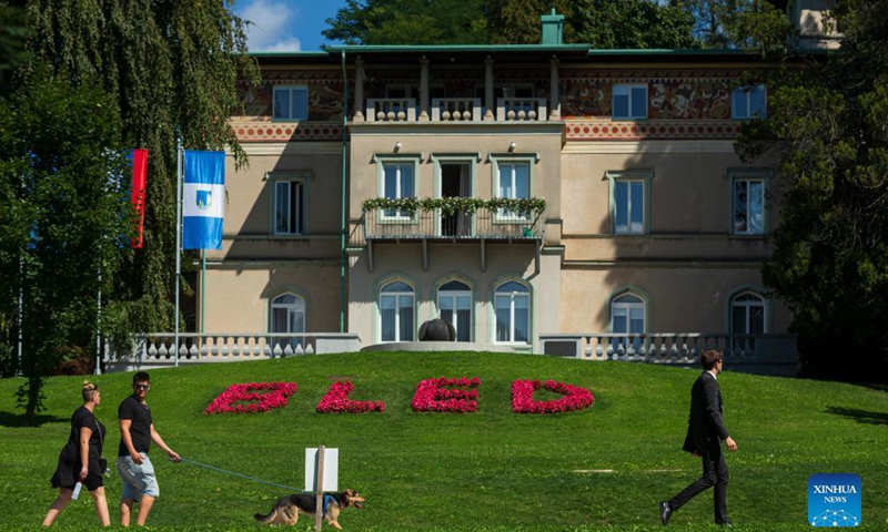People enjoy a sunny day at the bank of the Bled lake in Slovenia, Sept. 1, 2021. Bled lake is one of the most attractive tourist destinations in Slovenia.Photo:Xinhua