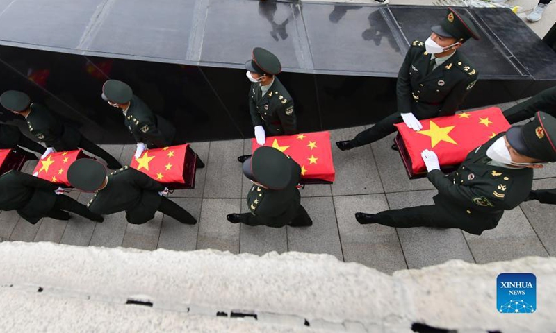 Coffins containing the remains of Chinese People's Volunteers (CPV) martyrs are escorted by soldiers during a burial ceremony at the CPV martyrs' cemetery in Shenyang, northeast China's Liaoning Province, Sept. 3, 2021.Photo:Xinhua