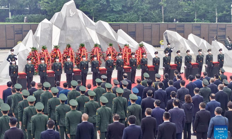 Photo taken with a mobile phone shows a scene of the burial ceremony for the remains of 109 Chinese People's Volunteers (CPV) martyrs in Shenyang, northeast China's Liaoning Province, Sept. 3, 2021. The remains of 109 Chinese soldiers killed in the 1950-53 Korean War were laid to rest on Friday in Shenyang.Photo:Xinhua