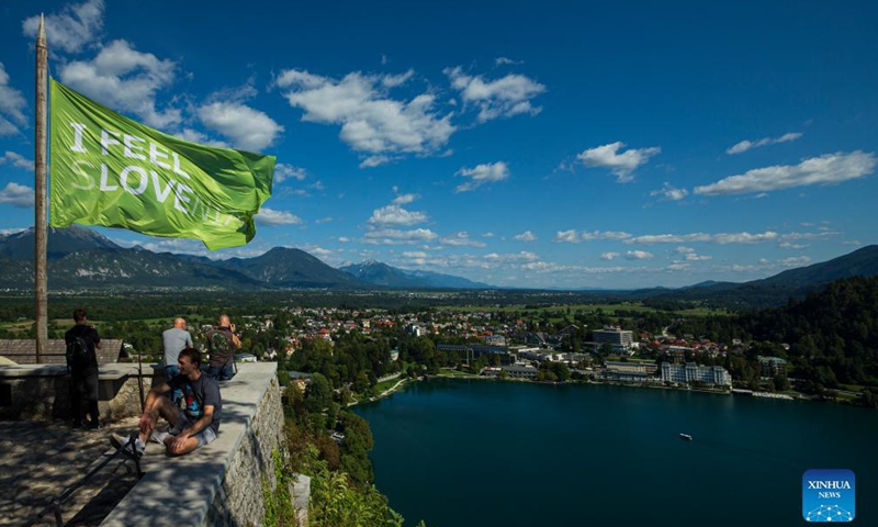 Visitors overlook Bled lake from Bled castle in Slovenia, Sept. 1, 2021. Bled lake is one of the most attractive tourist destinations in Slovenia.Photo:Xinhua