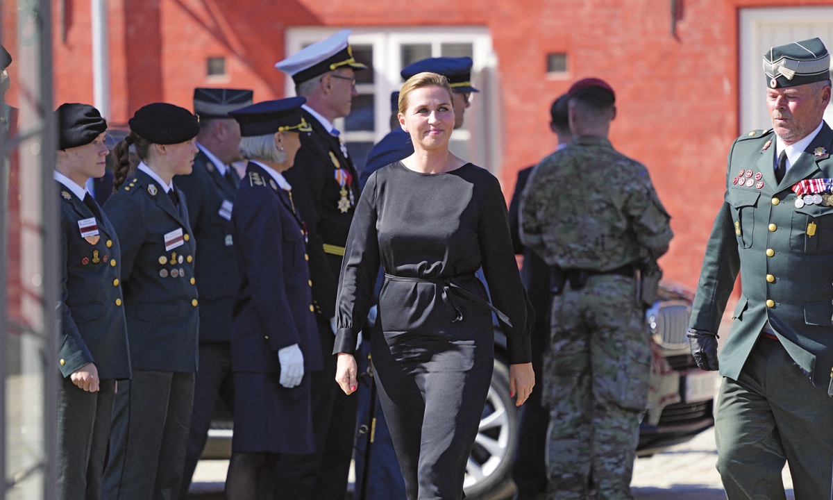 Denmark's Prime Minister Mette Frederiksen (center) arrives at the Military Headquarters Kastellet in Copenhagen, during a ceremony marking Flag Day on Sunday. Flag Day honors people who are or have been sent on a mission by Denmark. Photo: AFP