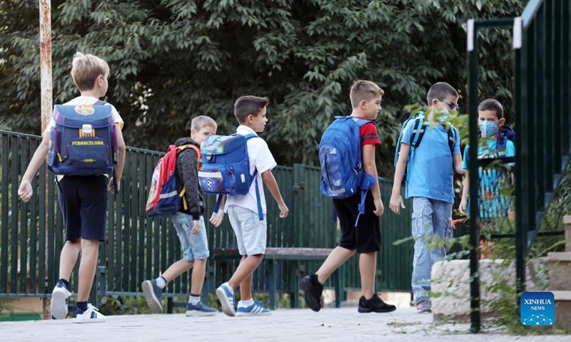 Children arrive at a school on the first day of a new school year in Sibenik, Croatia, on Sept. 6, 2021. Some 460,000 children went back to school in Croatia on Monday, as the country eased measures introduced to tackle COVID-19.(Photo: Xinhua)