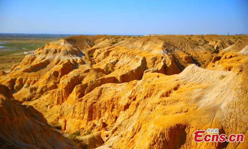 Photo taken on Sept. 5, 2021 shows the scenery of Devil City Scenic Spot in Fuhai County of Altay, Northwest China's Xinjiang Uygur Autonomous Region. The scenic spot is located in the east bank of Jili Lake, featuring Yardang landform and water landscape. Photo:CNSPhoto