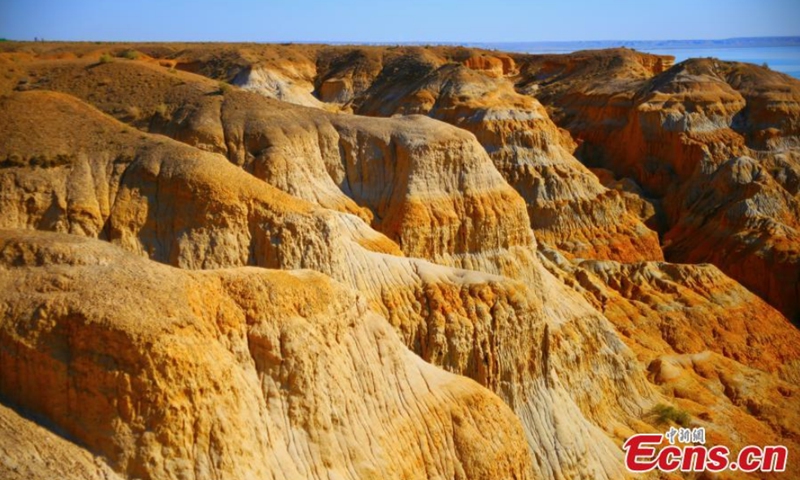 Photo taken on Sept. 5, 2021 shows the scenery of Devil City Scenic Spot in Fuhai County of Altay, Northwest China's Xinjiang Uygur Autonomous Region. The scenic spot is located in the east bank of Jili Lake, featuring Yardang landform and water landscape. Photo:CNSPhoto