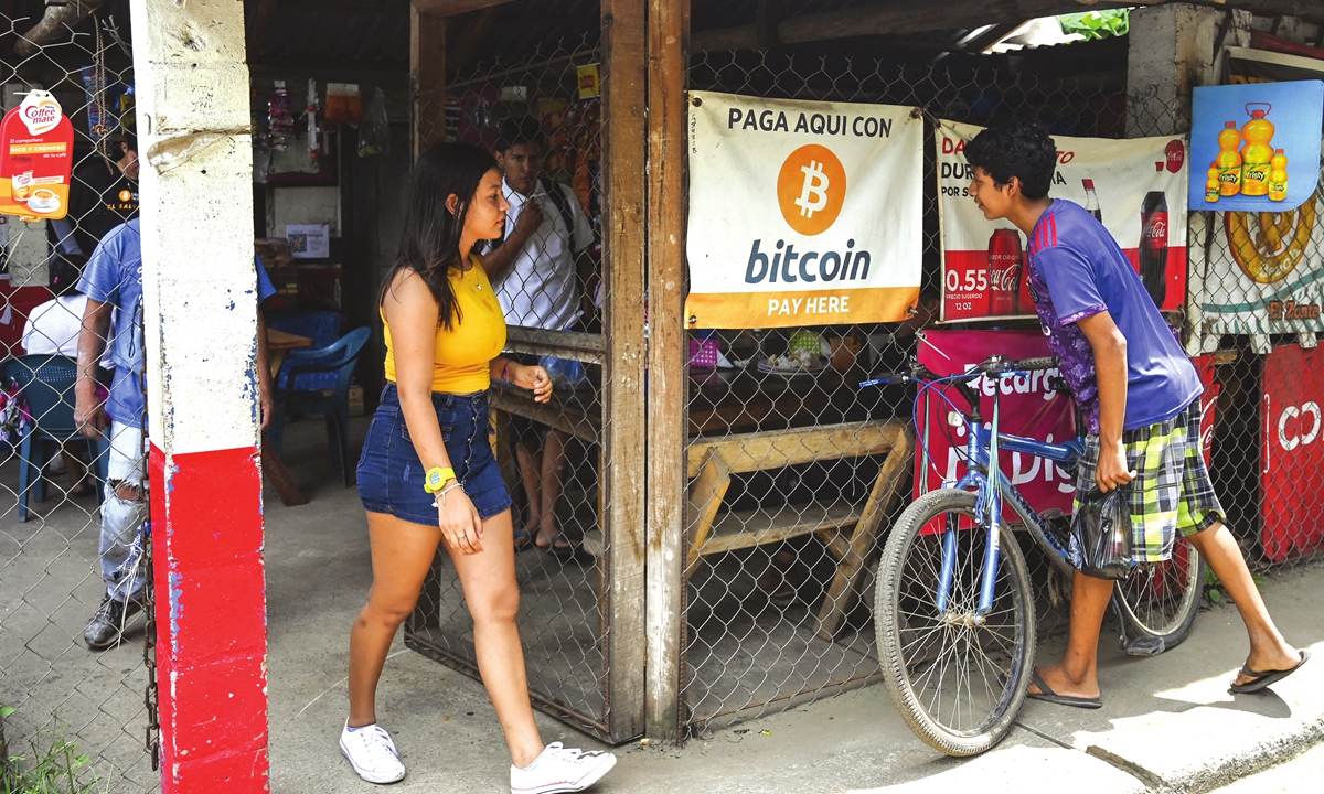 People are seen at a store where Bitcoin is accepted in El Zonte, El Salvador on Saturday. Photo: AFP