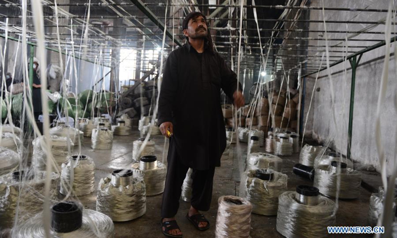 A man works at a glass wool factory in western Herat province, Afghanistan, Feb. 21, 2021. Photo: Xinhua