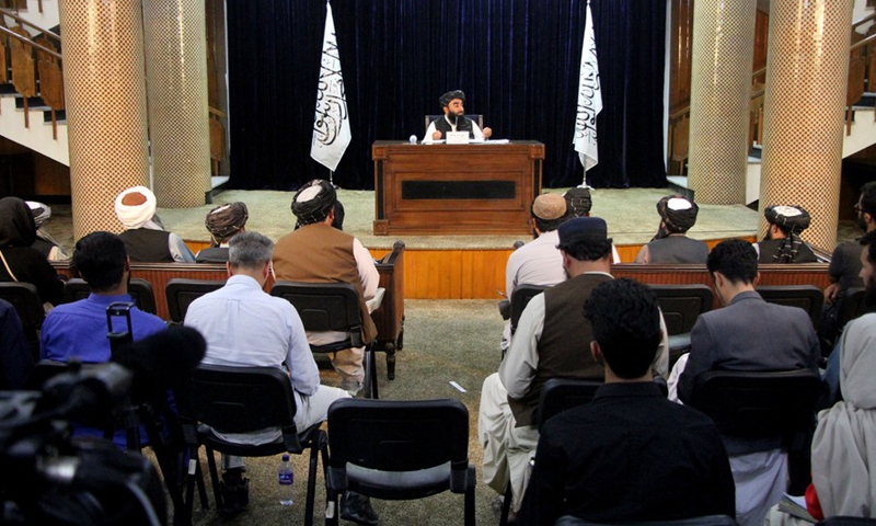 Taliban spokesman Zabihullah Mujahid (Rear) speaks during a press conference in Kabul, Afghanistan, on Sept. 7, 2021. The Taliban announced on Tuesday night the formation of Afghanistan's caretaker government, with Mullah Hassan Akhund appointed as the acting prime minister. (Photo: Xinhua)