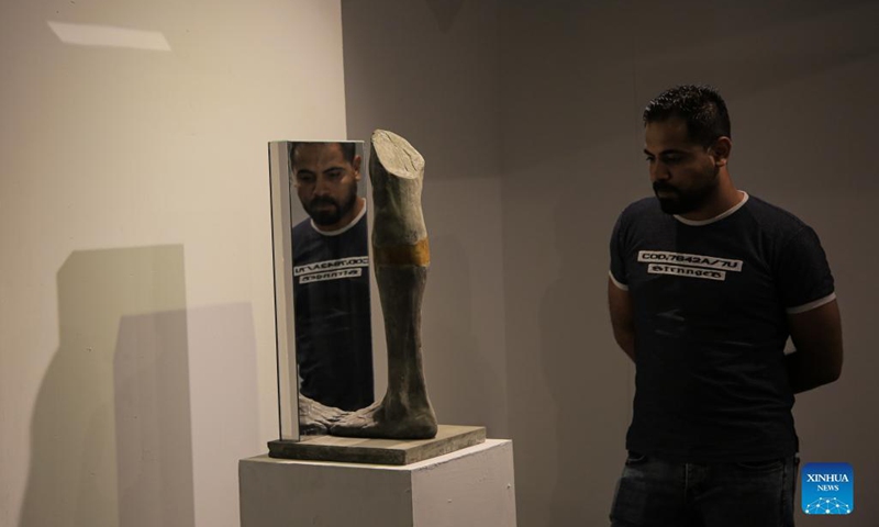 People visit an art exhibition at a contemporary art center in Gaza City, on Sept. 6, 2021. The artist depicted through his sculptures young Palestinians who lost their limbs during the wars and conflicts with Israel and the Great March of Return in the Gaza Strip.(Photo: Xinhua)