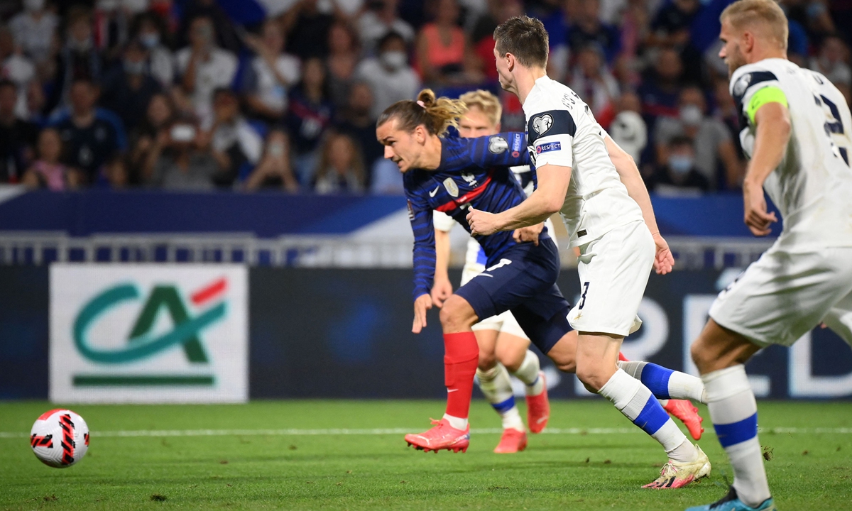 France forward Antoine Griezmann (left) runs to score his team's second goal against Finland on Tuesday. Photo: VCG