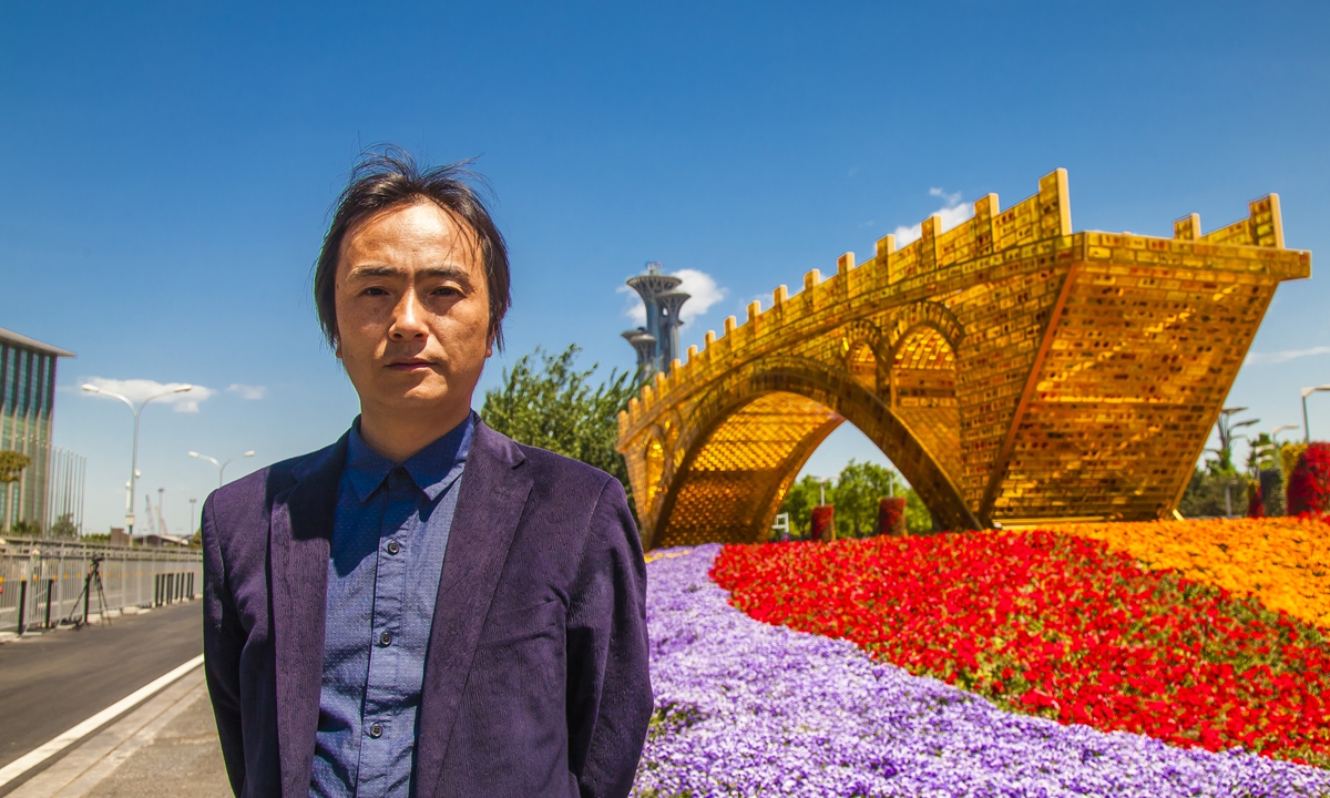 Shu Yong and his <em>Golden Bridge on the Silk Road</em> Photo: Courtesy of Ma Jun