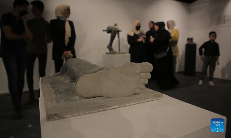 People visit an art exhibition at a contemporary art center in Gaza City, on Sept. 6, 2021. The artist depicted through his sculptures young Palestinians who lost their limbs during the wars and conflicts with Israel and the Great March of Return in the Gaza Strip.(Photo: Xinhua)