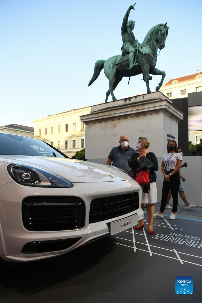 People visit the Porsche outdoor booth during the International Motor Show Germany (IAA Mobility) in Munich, Germany, Sept. 8, 2021. The IAA Mobility, with the slogan What will move us next, is held here from Sept. 7 to 12. Photo: Xinhua
