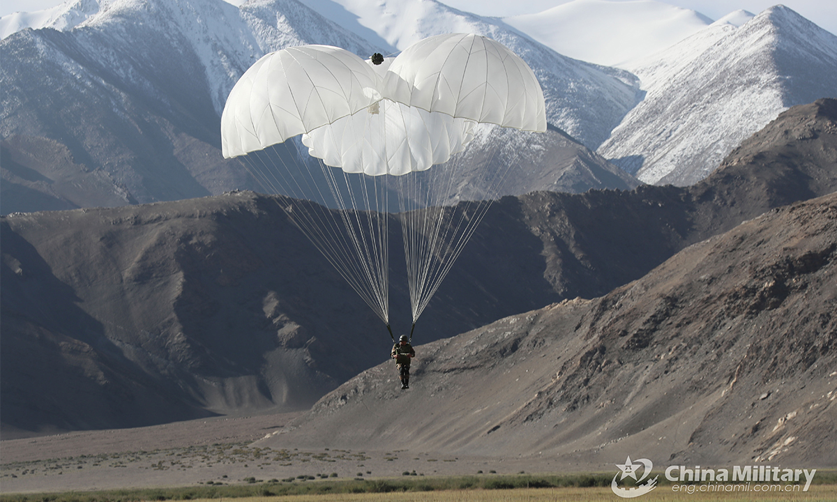 A paratrooper assigned to a special operations brigade under the PLA Xinjiang Military Command controls his parachute to reach the drop zone during a parachuting training exercise on August 31, 2021. This exercise effectively beefed up the troops' operation skills in plateau area. (eng.chinamil.com.cn/Photo by Shan Chuangyang)
