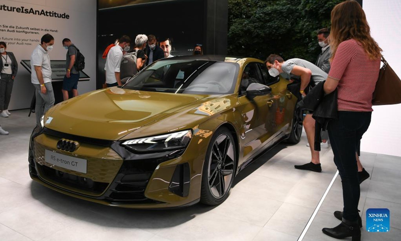 An Audi R5 e-tron GT is on display at the Audi outdoor booth during the International Motor Show Germany (IAA Mobility) in Munich, Germany, Sept. 8, 2021. With the slogan What will move us next, IAA Mobility focuses on green mobility, featuring electric cars and even bicycles. Photo: Xinhua 