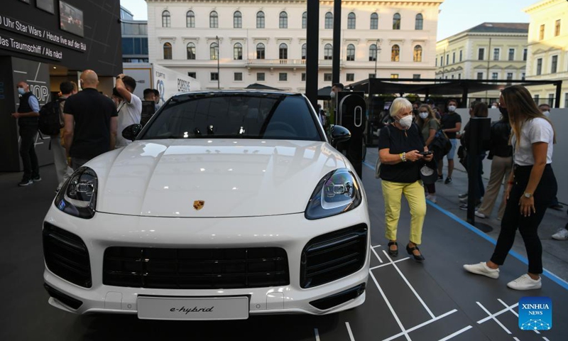 A Porsche Cayenne E-Hybrid Coupe is on display at the Porsche outdoor booth during the International Motor Show Germany (IAA Mobility) in Munich, Germany, Sept. 8, 2021. With the slogan What will move us next, IAA Mobility focuses on green mobility, featuring electric cars and even bicycles. Photo: Xinhua 