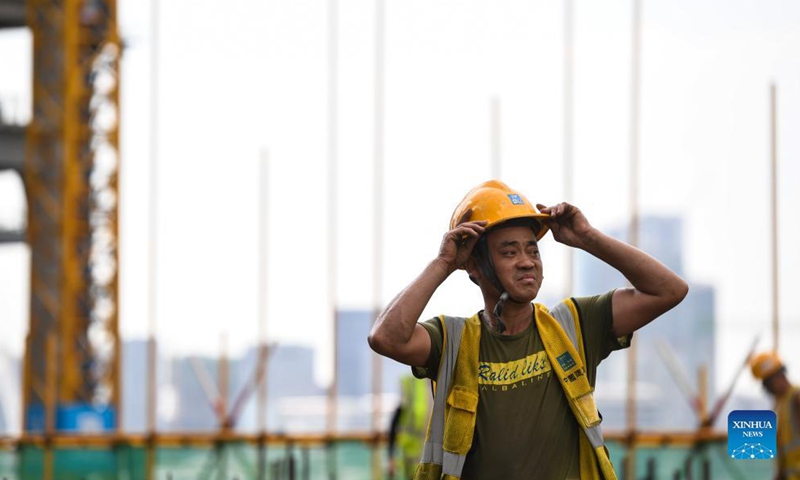 A worker is seen at the construction site for a transaction center in Qianhai, Shenzhen City, south China's Guangdong Province, on Sept. 8, 2021.Photo:Xinhua