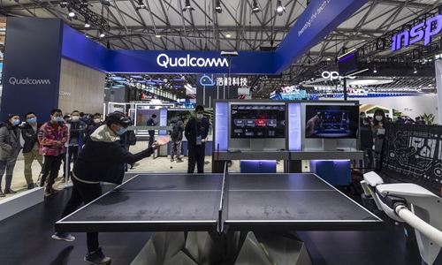A man plays table tennis with a robot on Qualcomm booth at the MWC (Mobile World Congress) Shanghai 2021 in Shanghai on February 23. Photo: IC