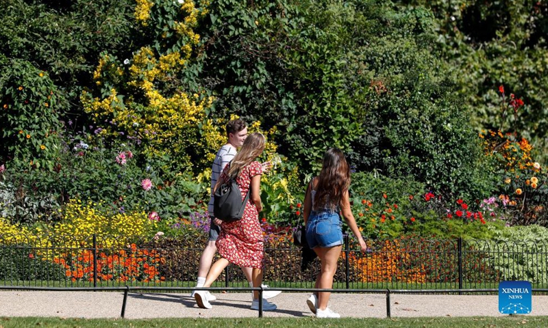 People enjoy the sunshine in St. James's Park in London, Britain, Sept. 8, 2021.Photo:Xinhua