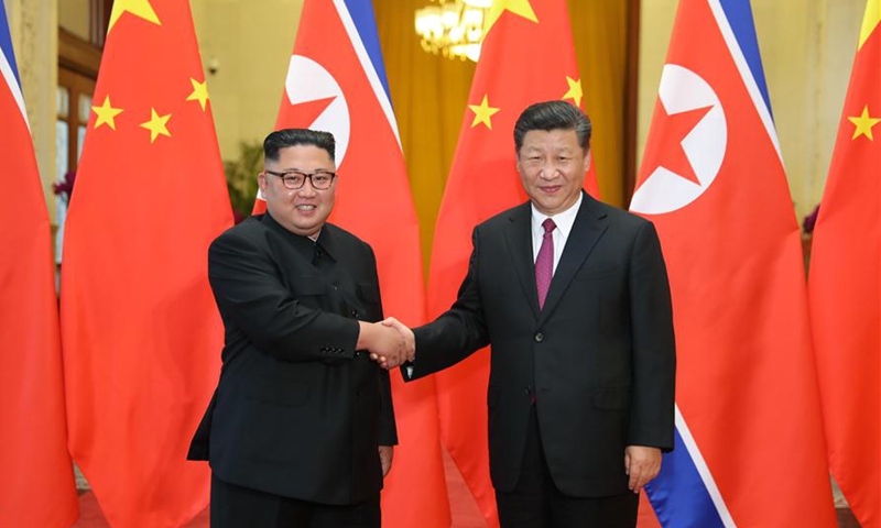 President Xi Jinping (right) holds talks with Kim Jong-un, chairman of the Workers' Party of Korea and chairman of the State Affairs Commission of the Democratic People's Republic of Korea (DPRK), in Beijing, capital of China, on June 19, 2018. (Photo: Xinhua)