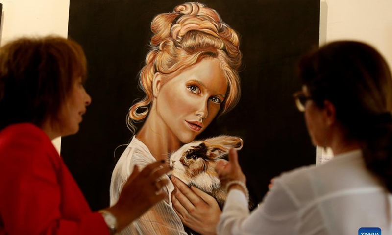 People visit an art exhibition in Beirut, Lebanon, on Sept. 8, 2021. Photo: Xinhua