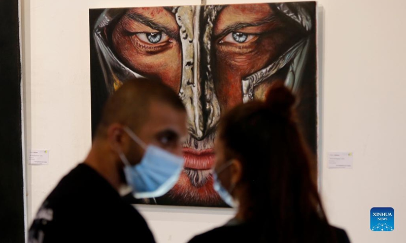 People visit an art exhibition in Beirut, Lebanon, on Sept. 8, 2021. Photo: Xinhua