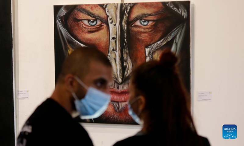 People visit an art exhibition in Beirut, Lebanon, on Sept. 8, 2021. Photo: Xinhua 