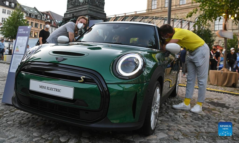 A Mini electric car is on display at the BMW outdoor booth during the International Motor Show Germany (IAA Mobility) in Munich, Germany, Sept. 8, 2021. With the slogan 