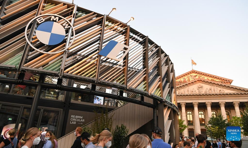 People visit the BMW outdoor booth during the International Motor Show Germany (IAA Mobility) in Munich, Germany, Sept. 8, 2021. The IAA Mobility, with the slogan What will move us next, is held here from Sept. 7 to 12. Photo: Xinhua 
